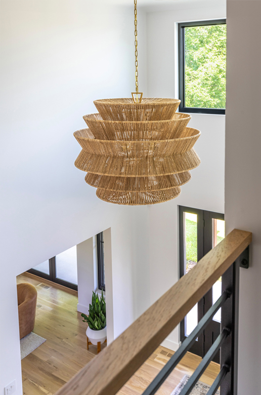 Inviting Boulder home foyer with sculptural chandelier and clean lines — Denver interior design meets minimalist sophistication