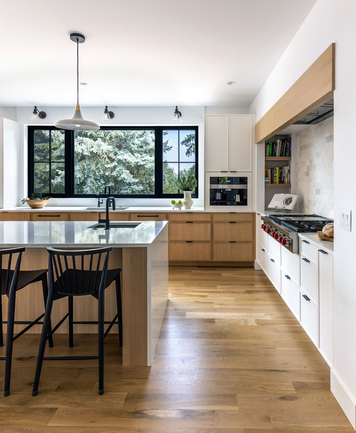 Modern Scandinavian-inspired Boulder kitchen with wood accents and clean cabinetry — Colorado interior design blending function and style