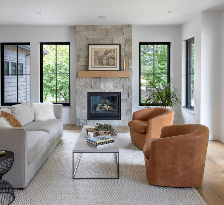 Contemporary Boulder living room with light wood flooring, organic textures, and minimalist styling — designed by Denver-based interior designer