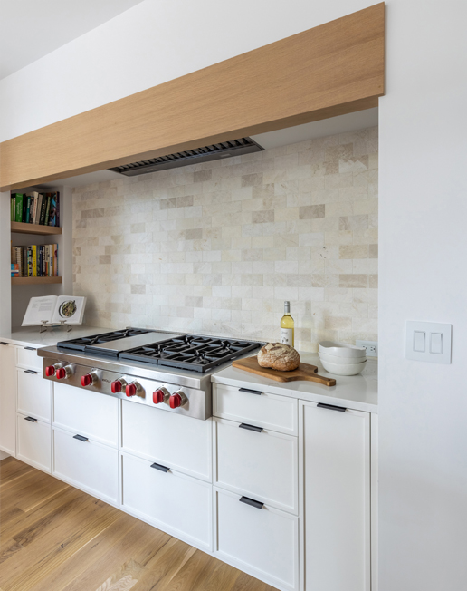 Close-up of kitchen range and custom hood in Boulder renovation — functional design meets modern luxury in Colorado homes